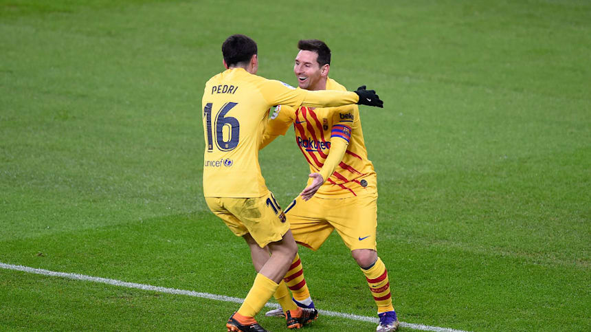 Messi celebrates with Pedri after scoring against Athletic Bilbao at San Mames on January 06, 2021. (Photo by Juan Manuel Serrano Arce/Getty Images)
