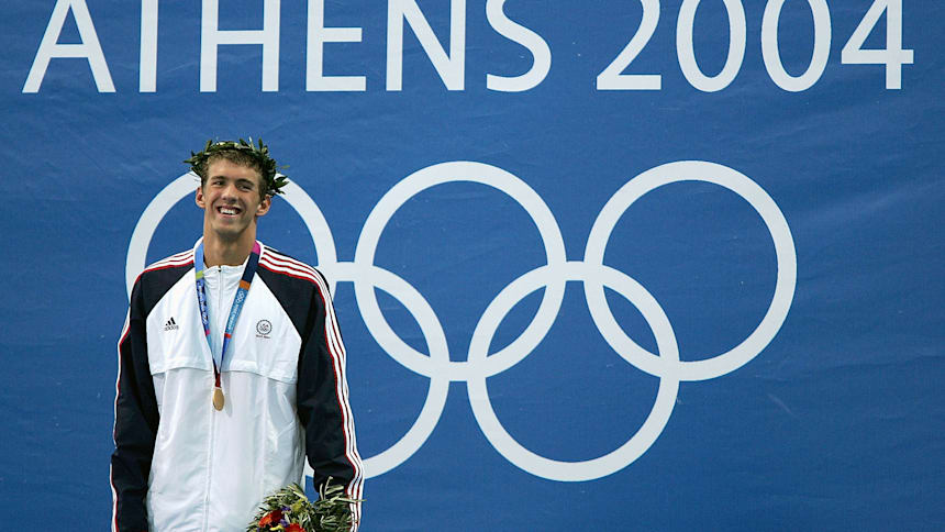 Michael Phelps celebrates his first Olympic gold medal at Athens 2004.