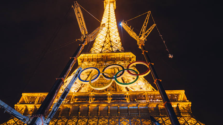 Olympic rings during their installation the Eiffel Tower