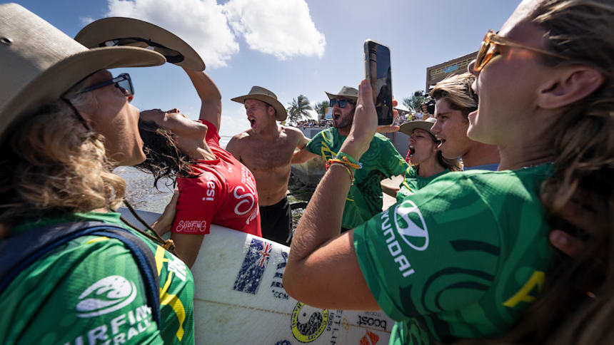 Sally Fitzgibbons chants with Team Australia after winning the 2024 ISA World Surfing Games.