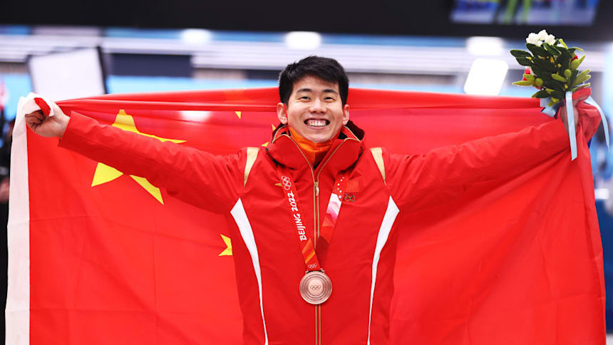 Bronze medallist Wengang Yan of Team China during the Men's Skeleton medal ceremony  