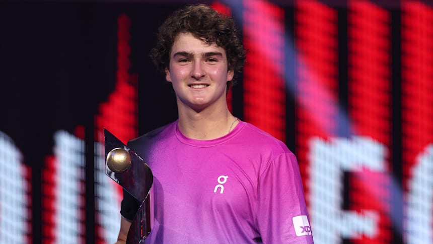 Joao Fonseca of Brazil poses for a photo with the Next Gen ATP Finals Trophy after winning the Men's Final match