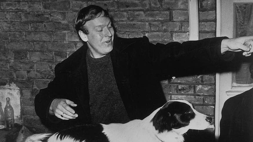 Pickles, the dog who found the stolen FIFA World Cup in 1966, with owner David Corbett.