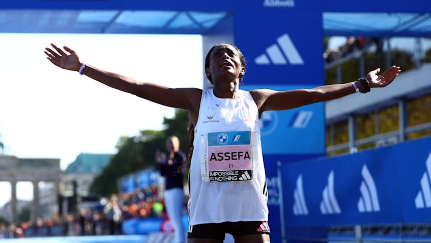 Tigst Assefa celebrates breaking the marathon world record by over two minutes at the 2023 Berlin Marathon