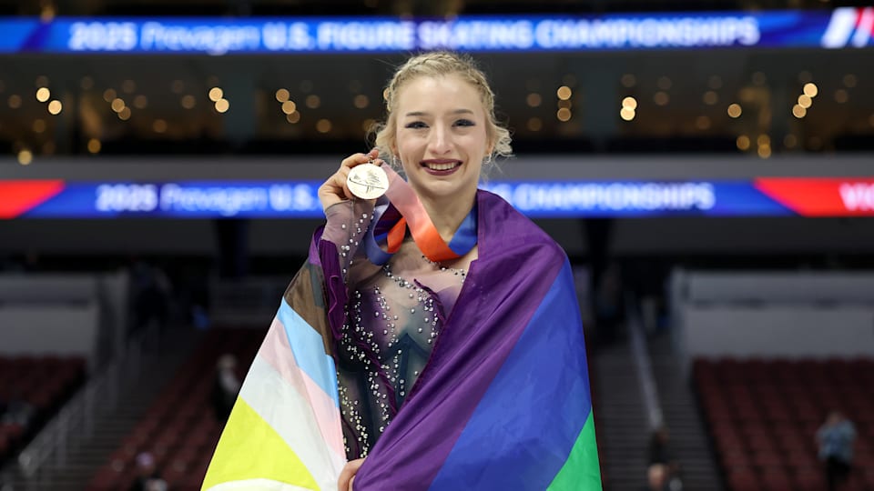 Amber Glenn poses with the gold medal after skating in the Championship Women Free Skate