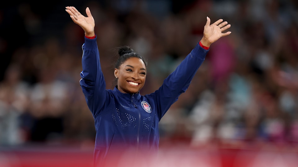 Gold medalist Simone Biles of Team United States celebrates on the podium during the medal ceremony for the Artistic Gymnastics Women's Vault Final 