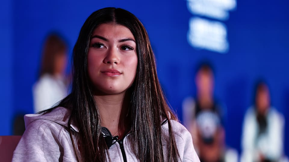 Gymnast Kayla DiCello looks on