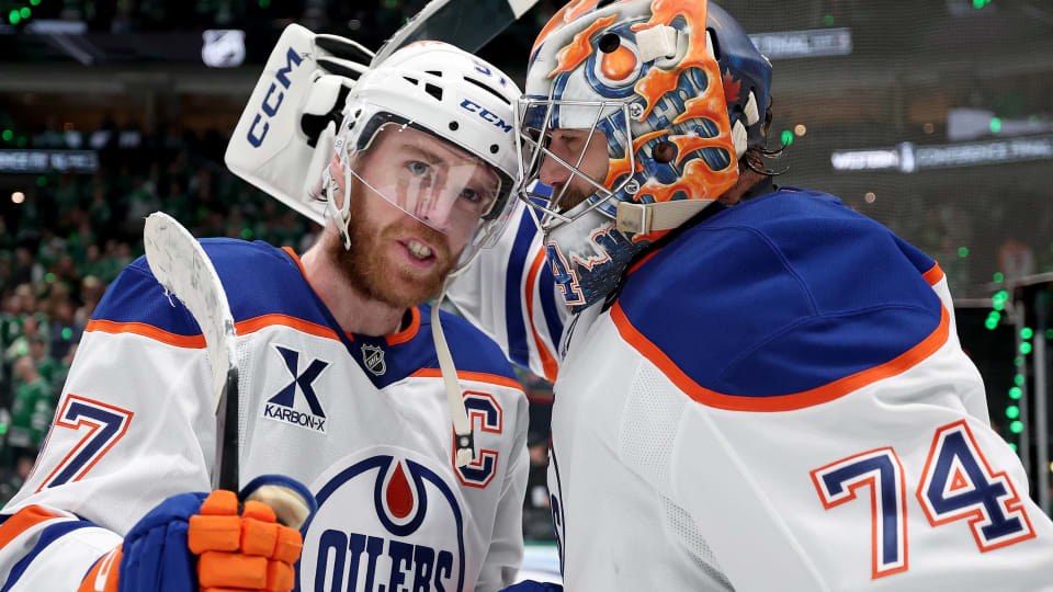 Connor McDavid and Stuart Skinner Edmonton Oilers celebrate after defeating the Dallas Stars in Game 5 to win the Western Conference final of the 2025 Stanley Cup playoffs.