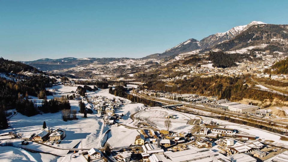 A charming panorama of the snow-capped mountains of Tesero