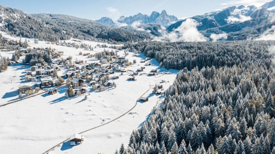 Foto del paesaggio innevato di Bellamonte Val di Fiemme