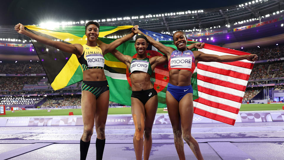 Gold medallist Thea Lafond of Team Dominica, Shanieka Ricketts of Team Jamaica and Jasmine Moore of Team USA