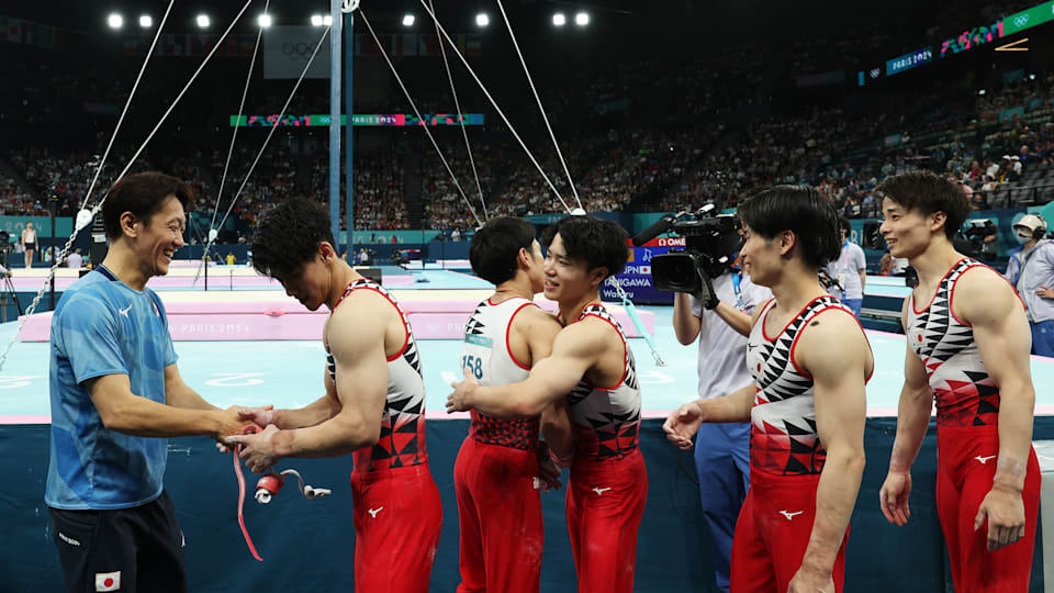 Members of Team Japan react following Subdivision 2 during the Artistic Gymnastics Men's Qualification on day one of the Olympic Games Paris 2024 at Bercy Arena on July 27, 2024 in Paris, France.