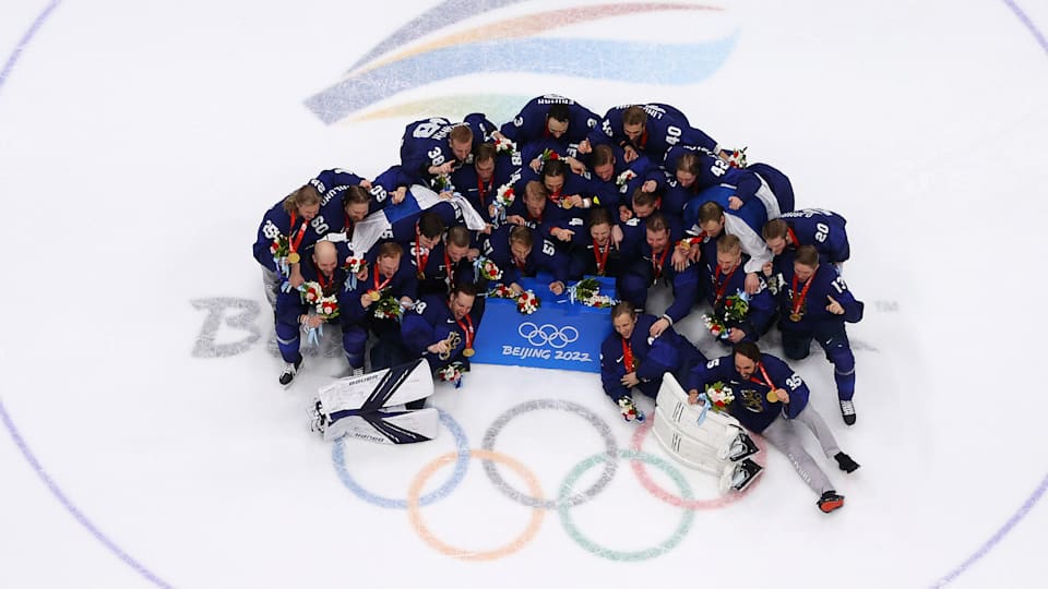 Members of Gold medallist Team Finland pose