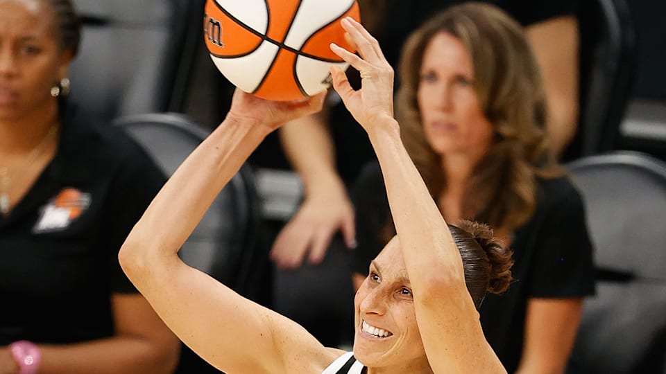 Diana Taurasi in action making history in the WNBA