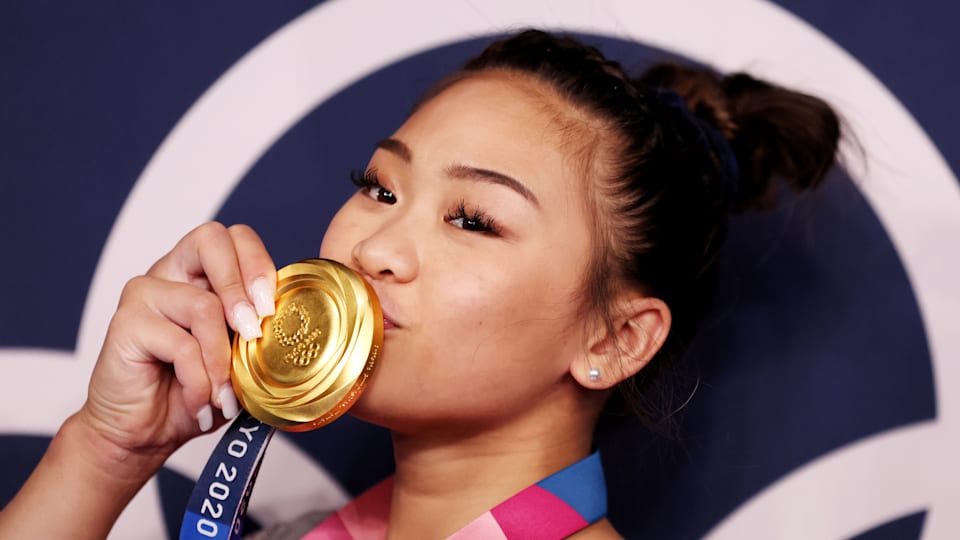 Sunisa Lee poses with her Olympic all-around gold medal