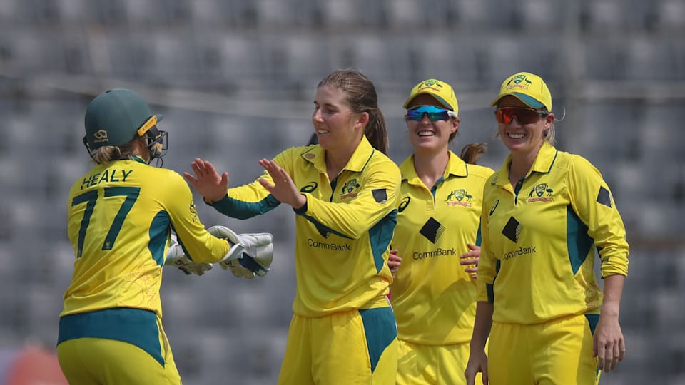 Australia's players celebrate a wicket.
