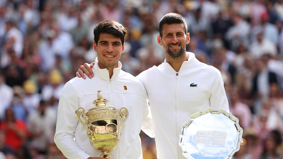 Carlos Alcaraz (L) with Novak Djokovic, Wimbledon 2024