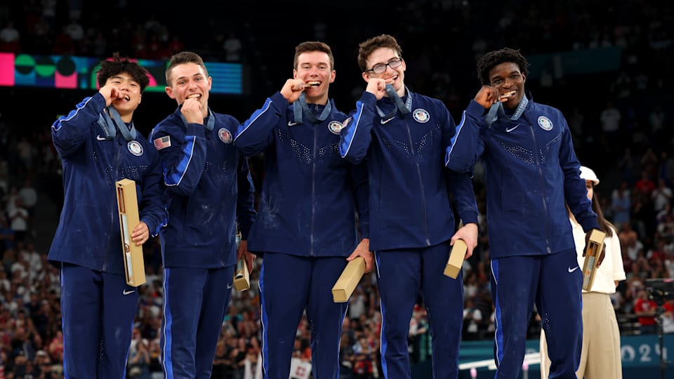 Bronze medalists Asher Hong, Paul Juda, Brody Malone, Stephen Nedoroscik and Frederick Richard of Team United States pose with their medals