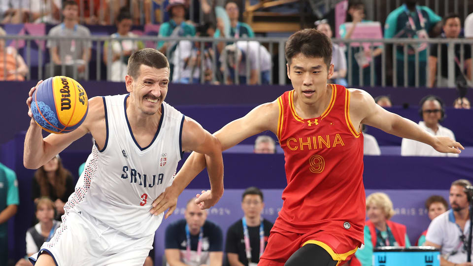 Strahinja Stojacic #3 of Team Serbia drives to the basket against Wenbo Lu #9 of Team People's Republic of China during a Men's Pool Round match on day five of the Olympic Games Paris 2024