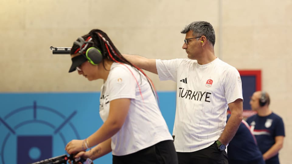 Türkiye’s Yusuf Dikec (right) competes in the shooting 10m air pistol mixed team gold medal at Paris 2024.