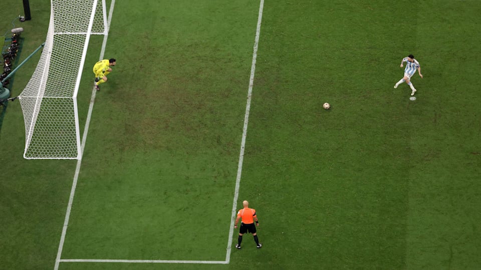 Lionel Messi takes a kick during a penalty shootout at the FIFA World Cup 2022 final.