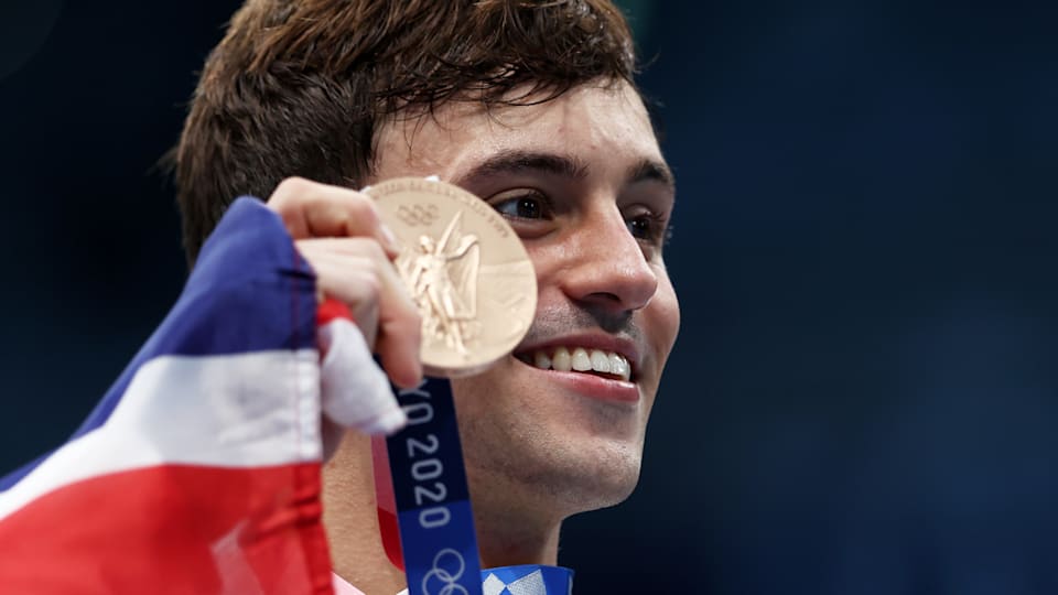 Tom Daley poses with his Olympic bronze medal at Tokyo 2020 