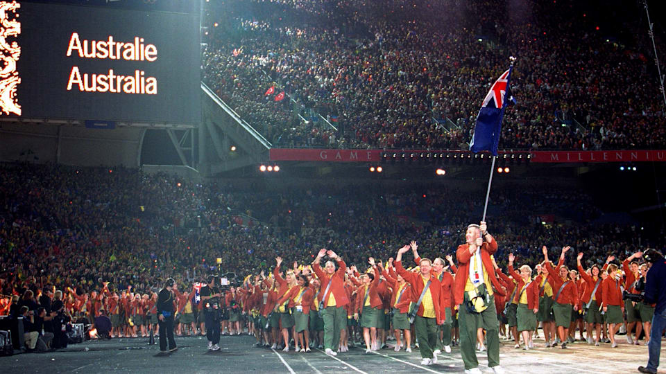The Australian Olympic Team is led by Flag Bearer and Basketball competitor Andrew Gaze during the Opening Ceremony of the Sydney 2000 Olympic Games at the Olympic Stadium in Homebush Bay, Sydney, Australia.