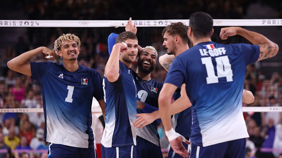 Trevor Clevenot of Team France celebrates with teammates after scoring a point during the Men's Gold Medal Match between Team France and Team Poland