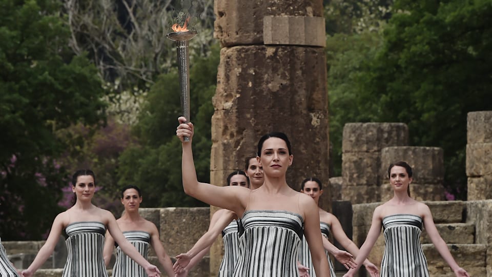 Greek actress Mary Mina, playing the role of the High Priestess, holds the torch during the flame lighting ceremony for the Paris 2024 Summer Olympics at Ancient Olympia