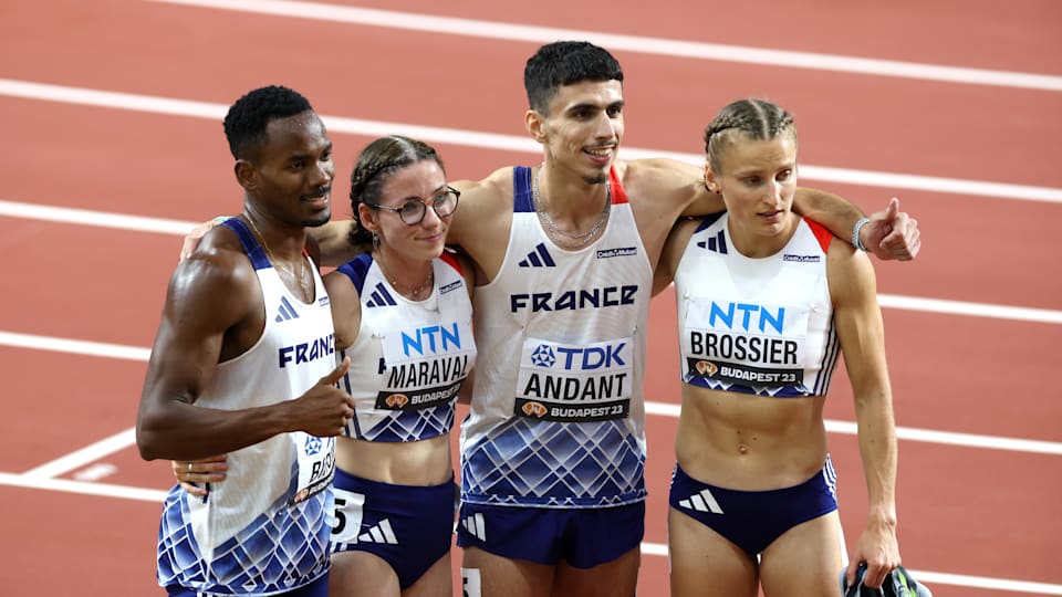 Gilles Biron, Louise Maraval, Teo Andant and Amandine Brossier of Team France after the 4x400m Mixed Relay Final at the World Athletics Championships 2023 in Budapest, Hungary.