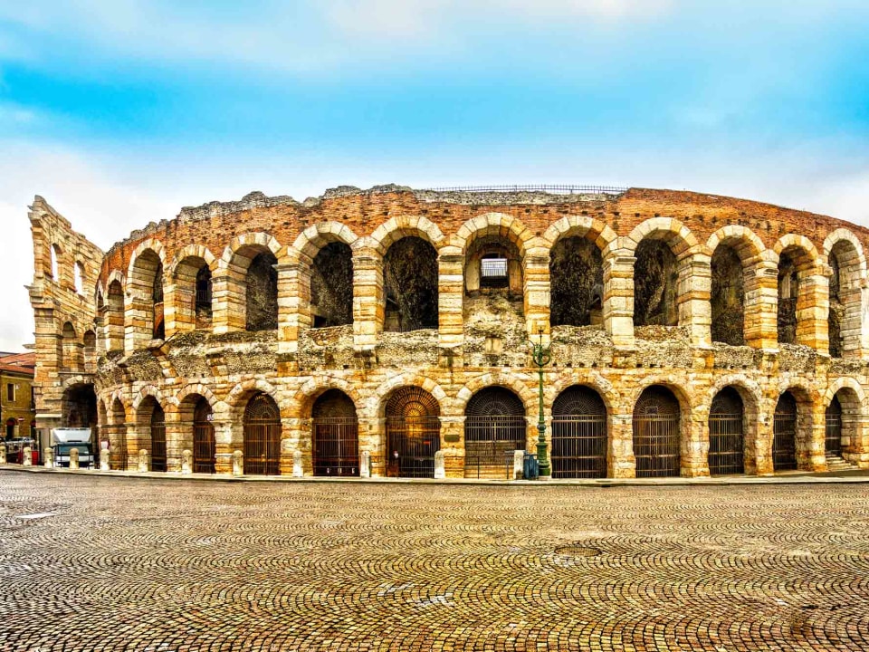 View from outside the Verona Arena with a blue sky in the background