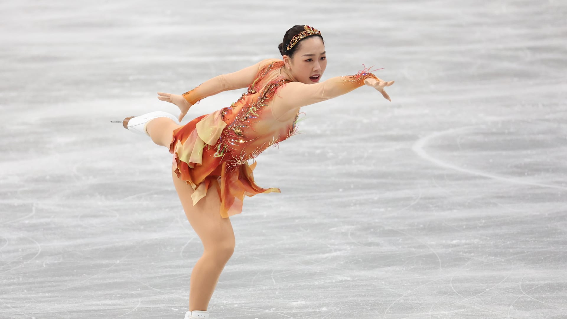 See how Olympic figure skating costumes have changed through the years