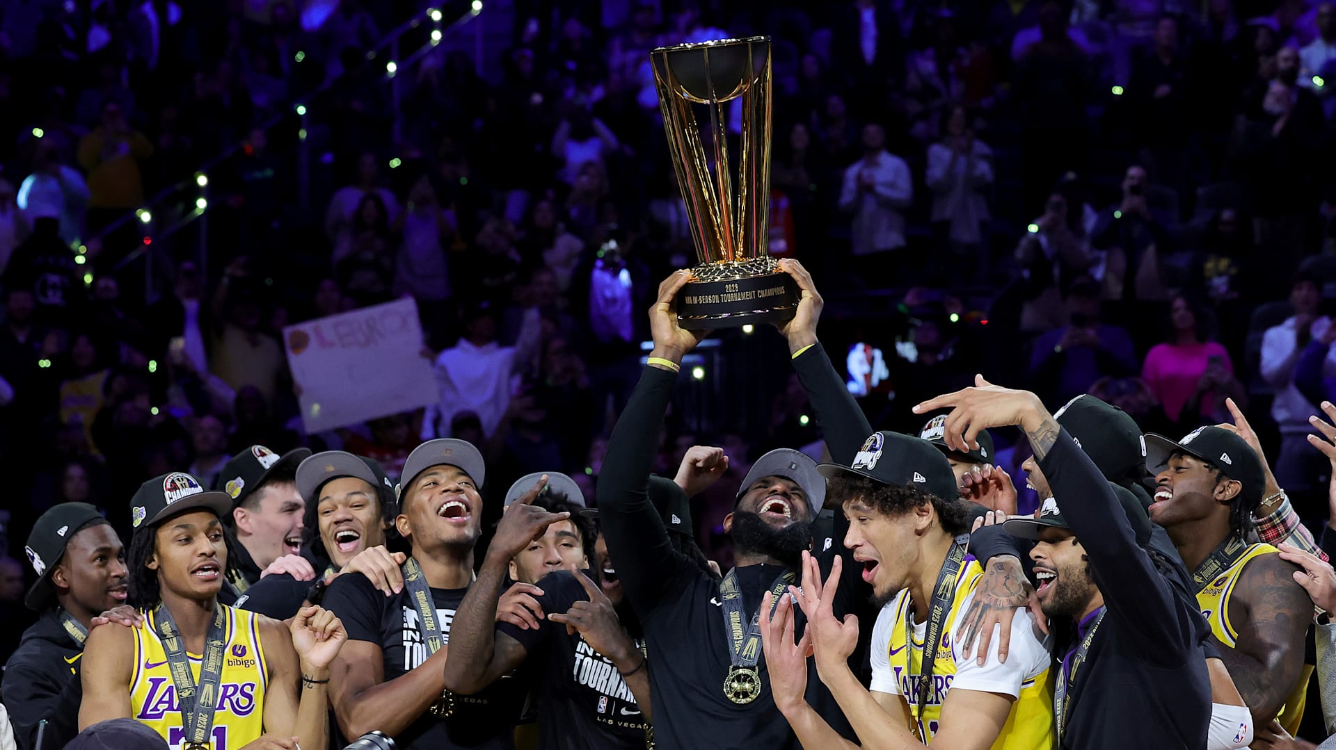 Lebron holding new arrivals trophy