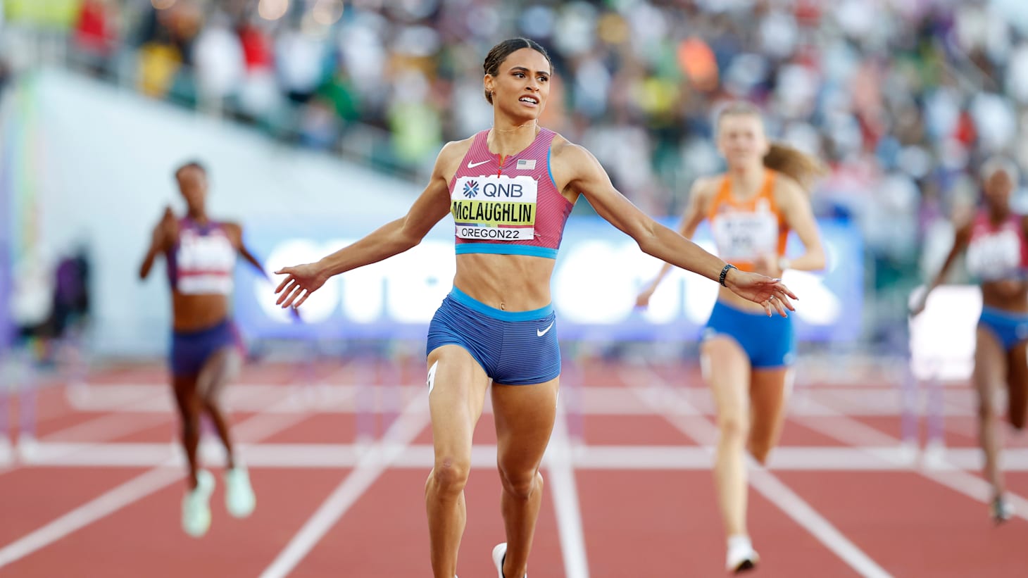 Female athletes sprinting. Women in sport clothes run at the