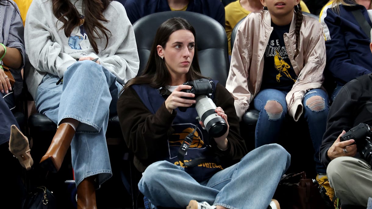 Caitlin Clark works as courtside photographer at Pacers vs Lakers NBA game