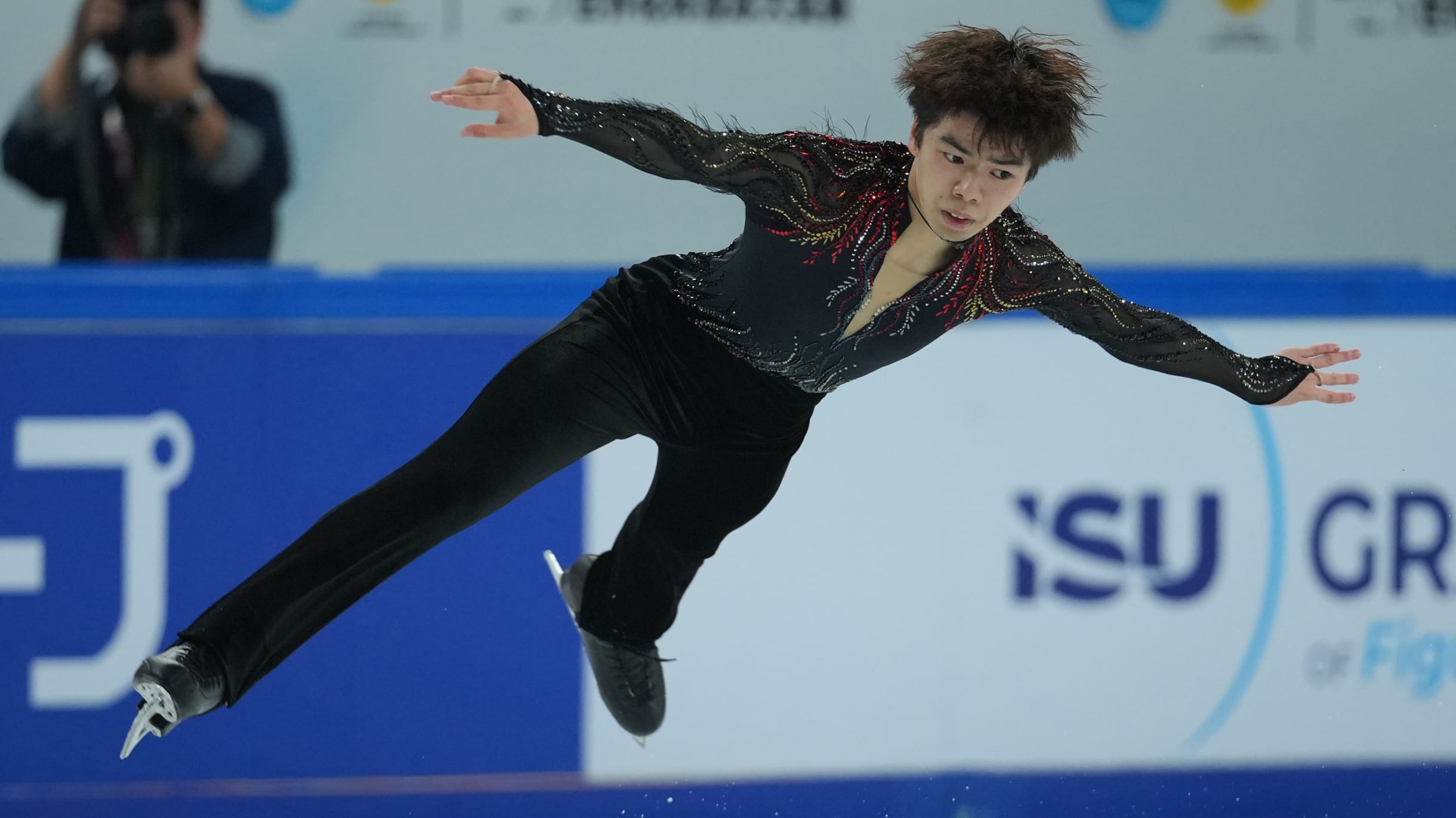 Figure skating - Cup of China 2025: Japan's Sato Shun flies as he