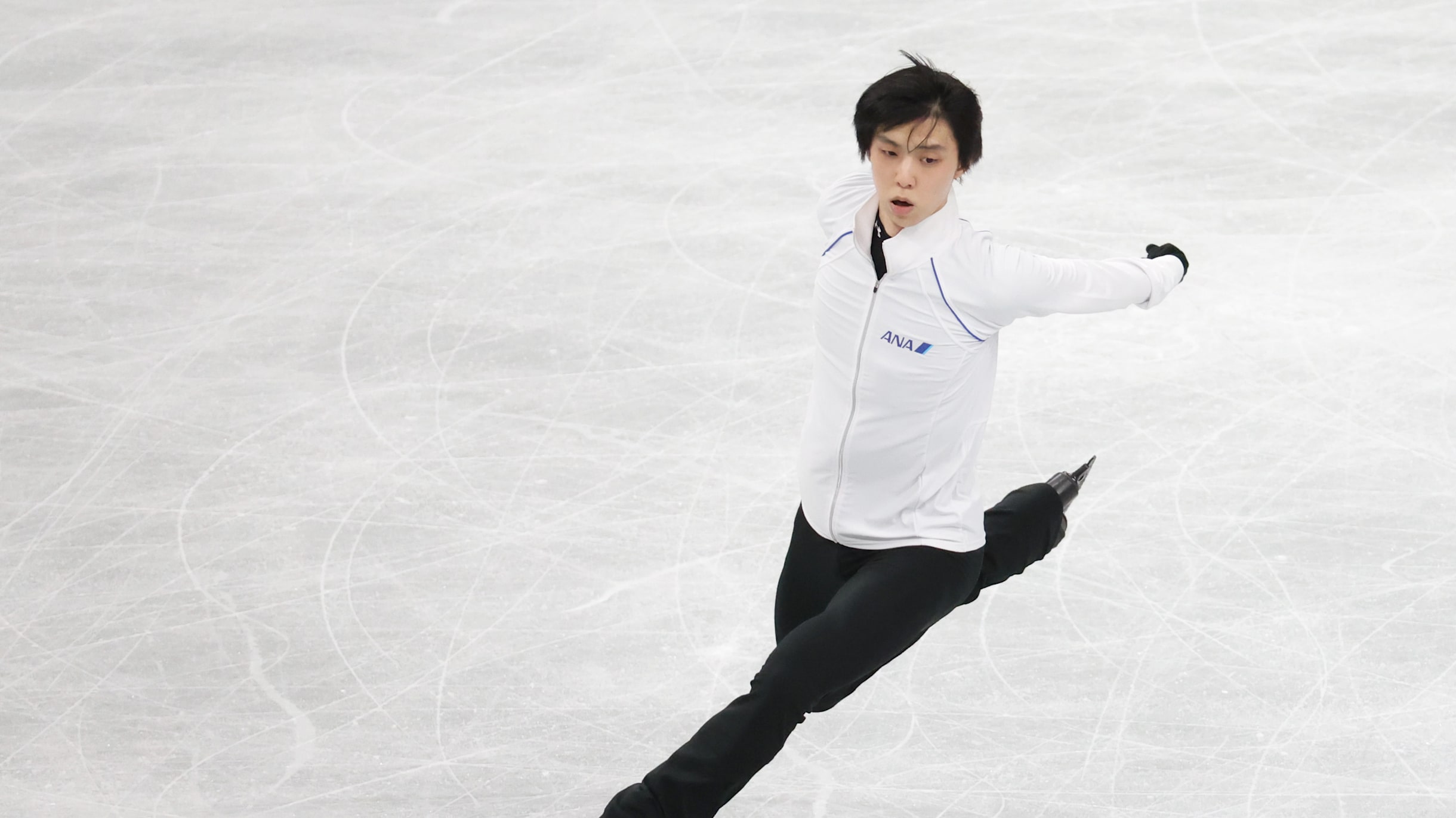 Detail Of The Black And White Mens Ice Skates In Action On Ice