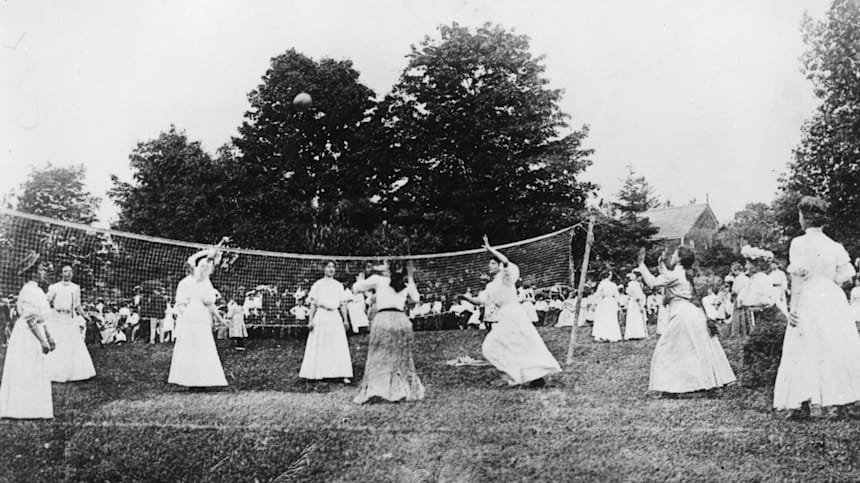 A group of ladies playing a game of volleyball in 1900.