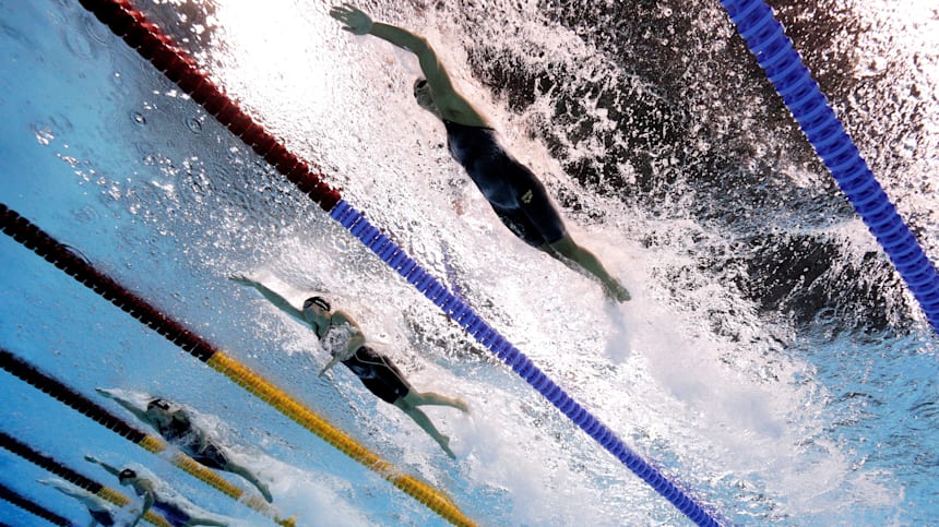 An underwater action shot of female swimmers, side-by-side competing in an Olympic race at Rio 2016