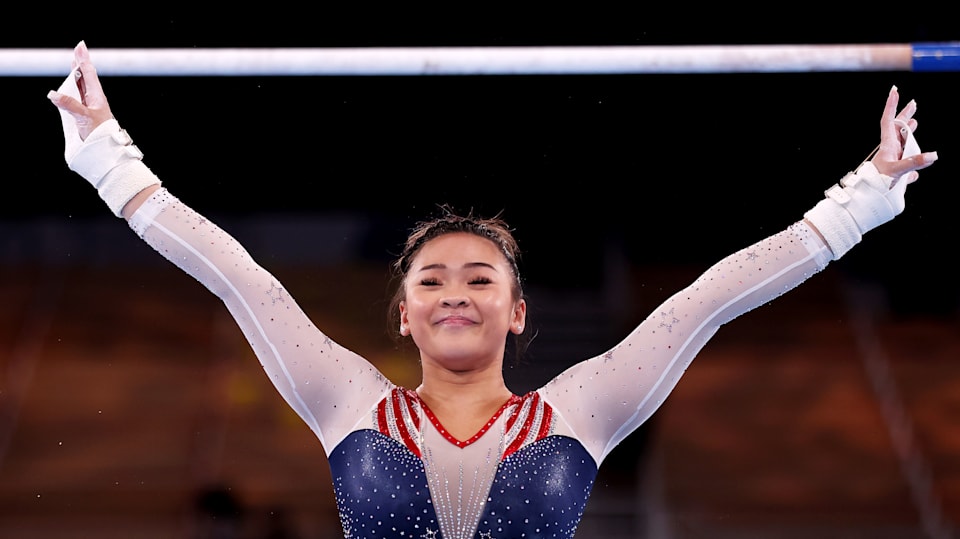 Sunisa Lee of Team United States reacts after competing on uneven bars