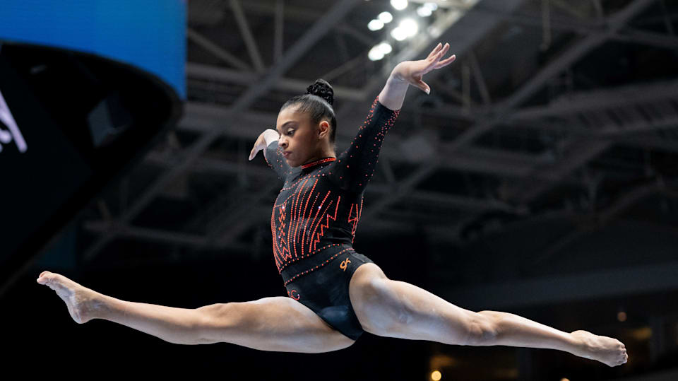Tiana Sumanasekera performs on the balance beam