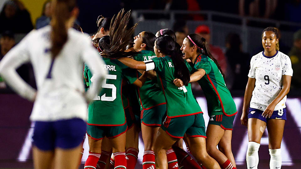 Mexico celebrate their second goal vs the United States on Monday (26 February).