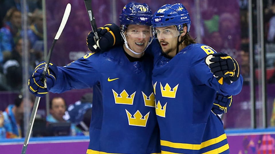 Victories for Sweden and Switzerland as men s ice hockey