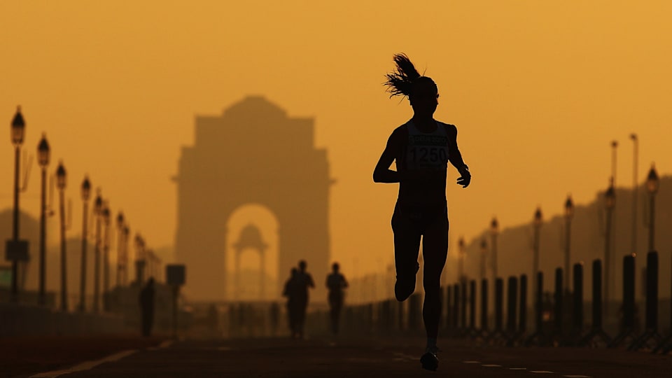 An athlete competes in the women's marathon in New Delhi, India.