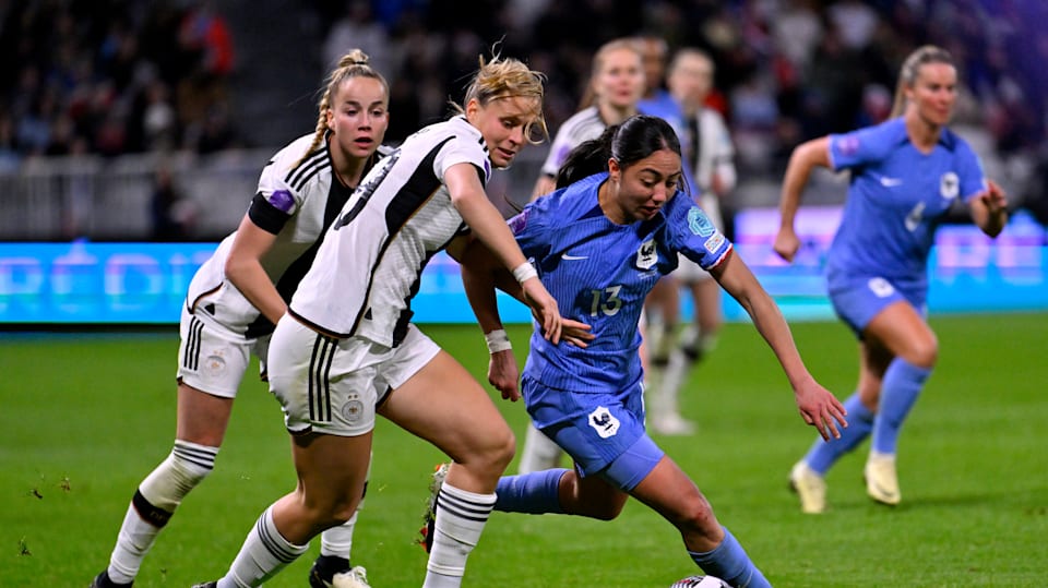 DECINES-CHARPIEU, FRANCE - FEBRUARY 23: Klara Buehl of Germany challenges for the ball with Selma Bacha of France during the UEFA Women's Nations League Semi-Final match between France and Germany at OL Stadium on February 23, 2024 in Decines-Charpieu, France.