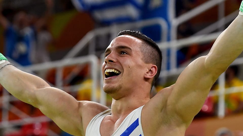 Favourites prevail in men s rings and vault