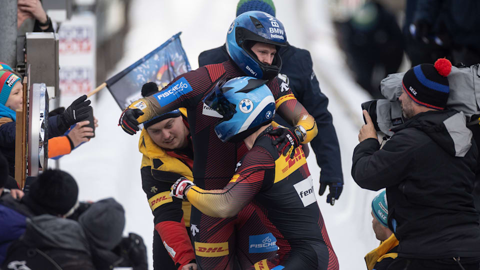 Francesco Friedrich and Alexander Schüller of Germany celebrate after their final round of the 2-man Bobsleigh competition at the BMW IBSF Bobsleigh And Skeleton World Championship at Veltins Eis-Arena on February 25, 2024 in Winterberg.
