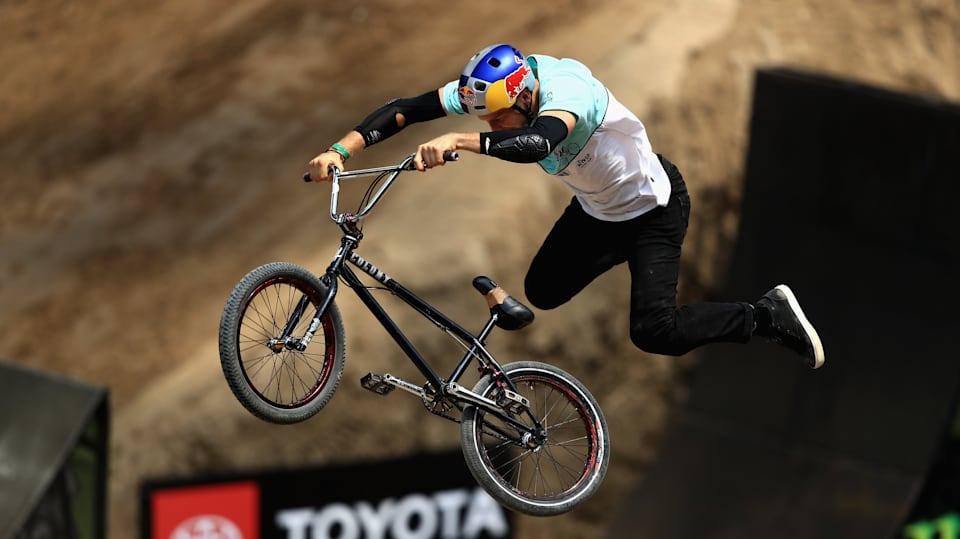 Dawid Godziek lands world s first mountain bike quadruple tail whip