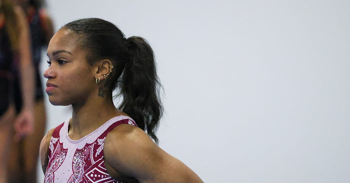 Shilese Jones drops out during one of the American Olympic trials after an exercise on the uneven bars