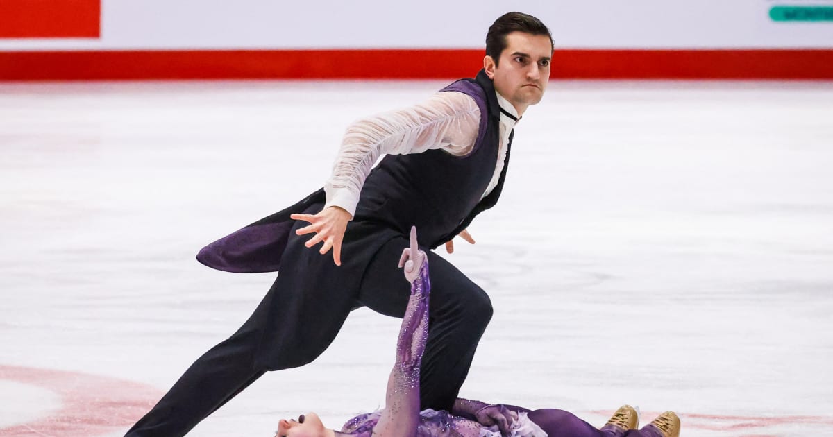 Figure skaters in Halloween costumes on ice